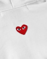 Back view of CDG Play white hoodie, showing unisex style and comfortable fit